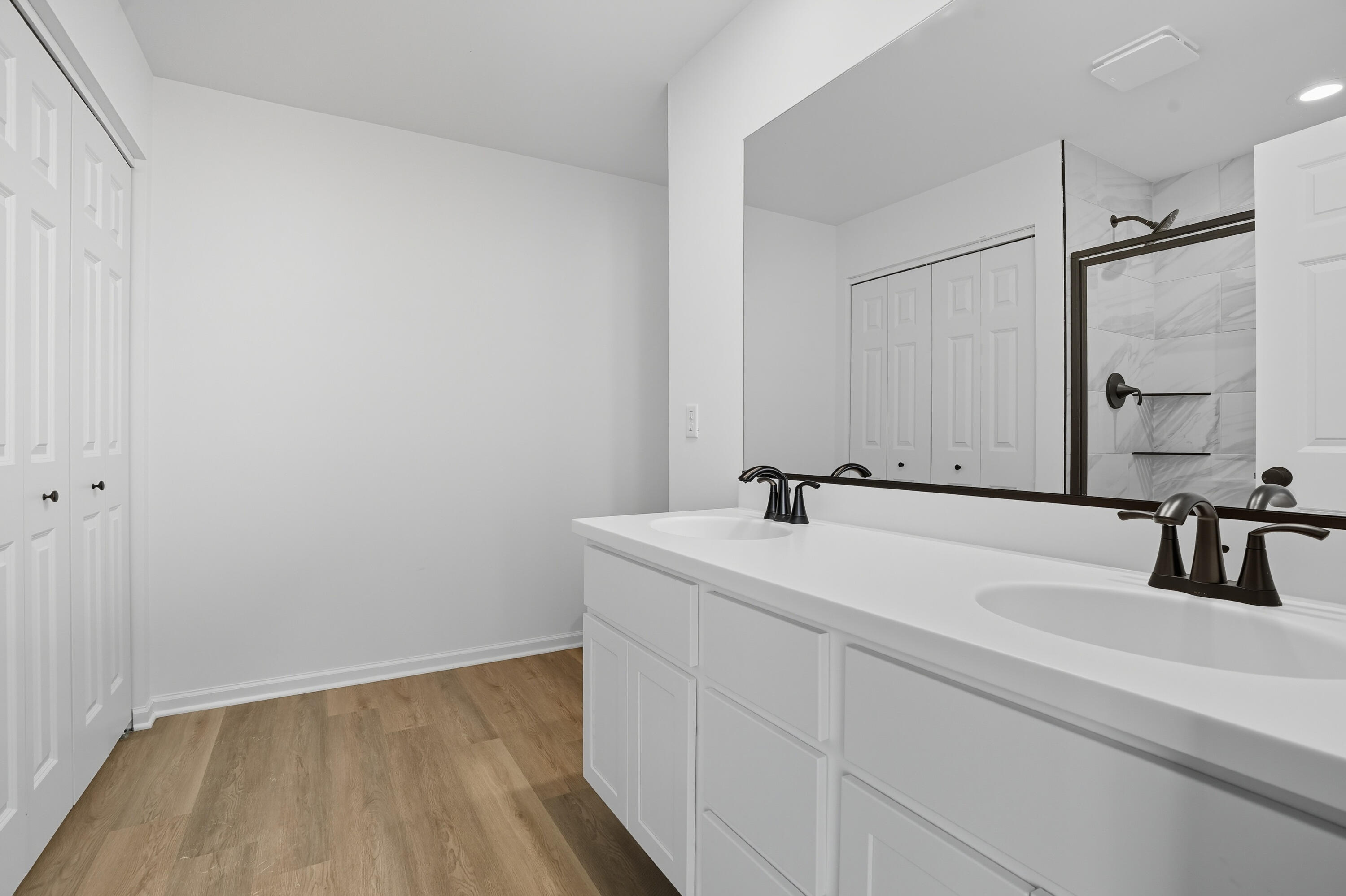 6866 East 104th Avenue Crown Point, IN 46307 - Photo 10 of 16 a bathroom with a sink and a mirror
