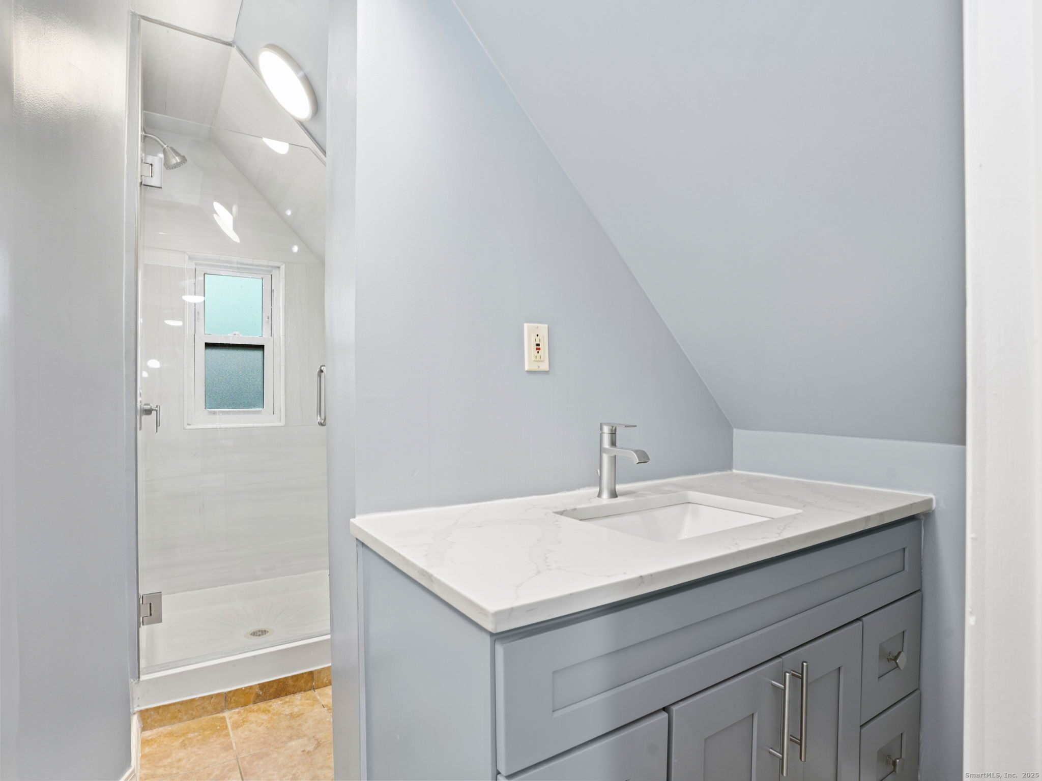 90 Amsterdam Avenue, Unit 2 Bridgeport, CT 06606 - Photo 7 of 10 a bathroom with a sink a vanity and a mirror