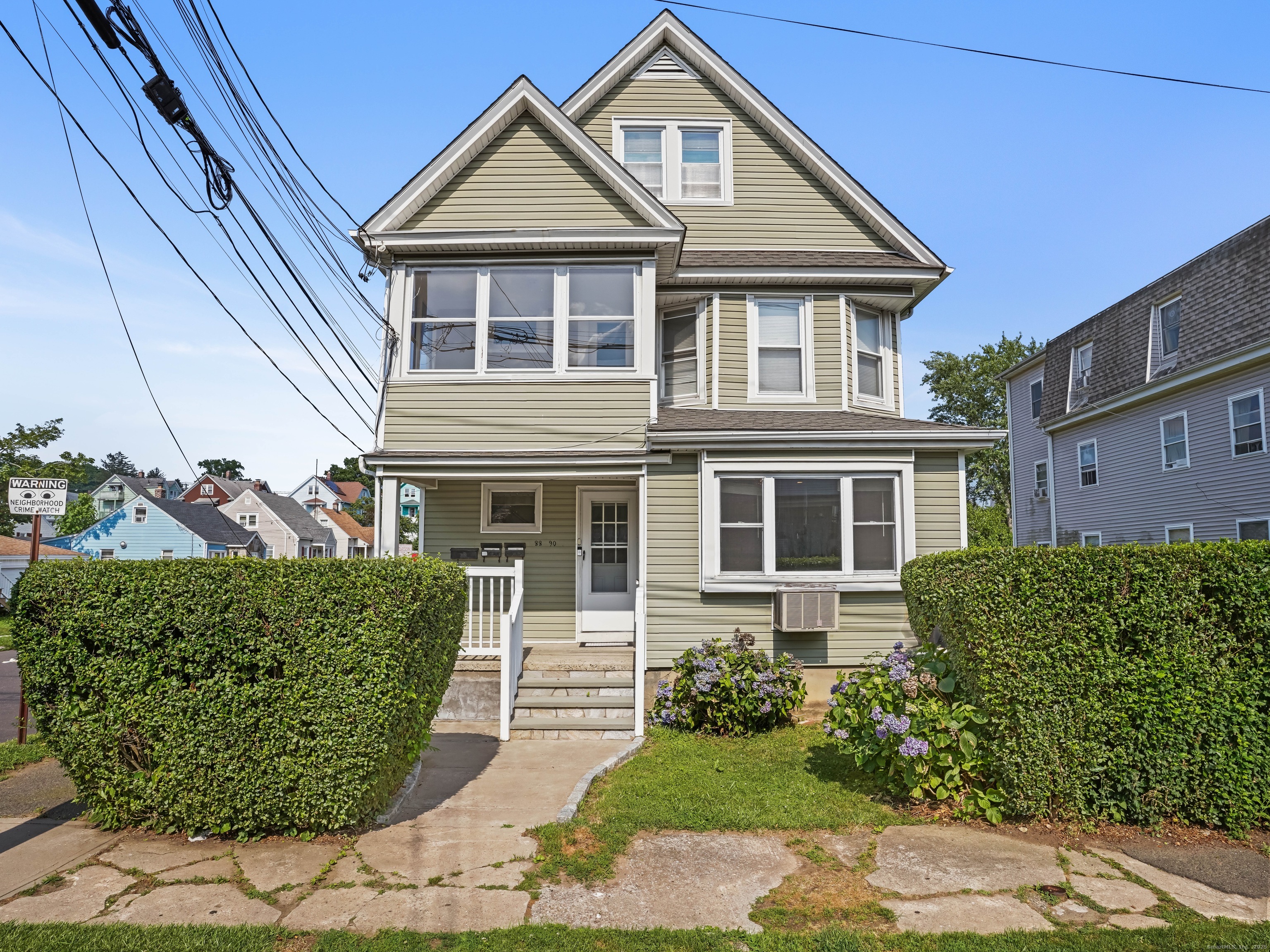 90 Amsterdam Avenue, Unit 2 Bridgeport, CT 06606 - Photo 9 of 10 a front view of a house with garden