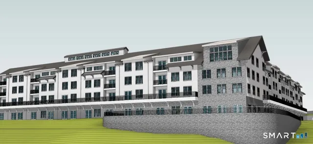 a view of front of building with yard