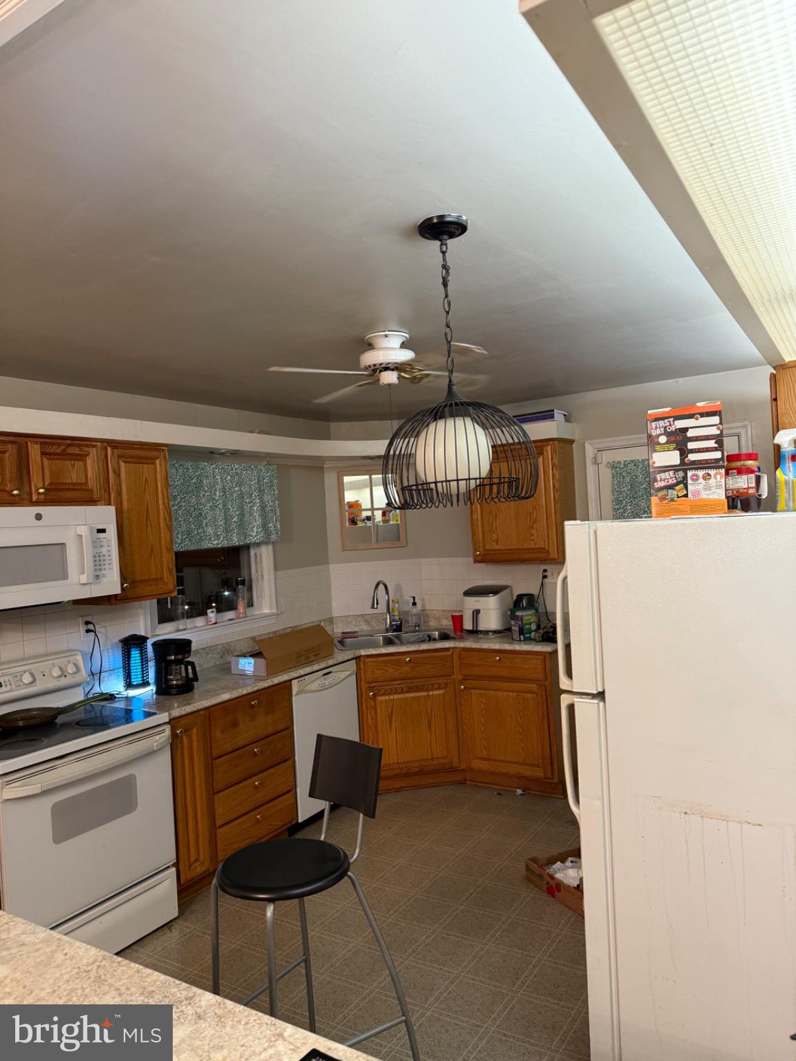4305 Briggs Chaney Road Beltsville, MD 20705 - Photo 7 of 26 Cozy kitchen with warm wooden accents.