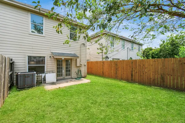 a view of a house with a yard and porch
