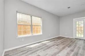 a view of an empty room with a window