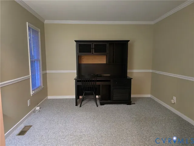 a living room with furniture and a air conditioner vent