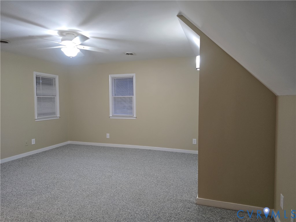 14300 Michaux View Way Midlothian, VA 23113 - Photo 19 of 29 a view of an empty room with a chandelier fan