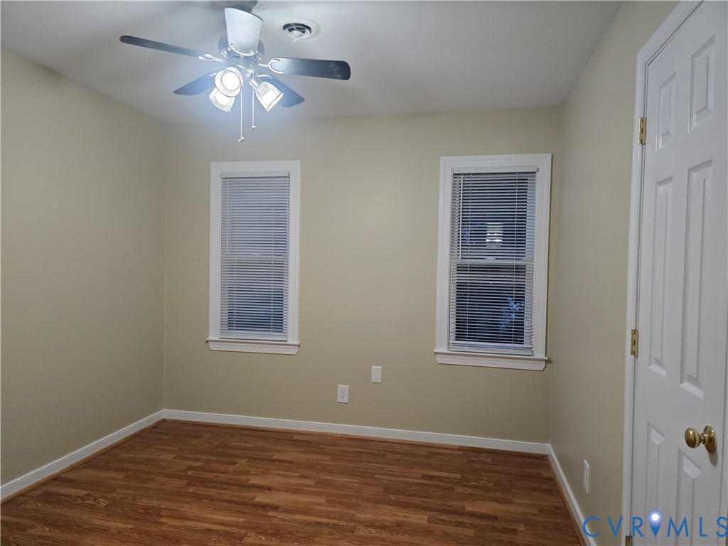 14300 Michaux View Way Midlothian, VA 23113 - Photo 26 of 29 an empty room with wooden floor closet and windows