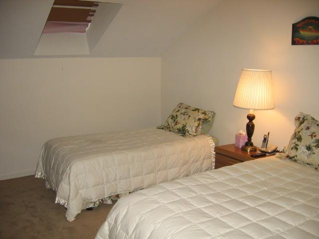835 Gangplank Road, Unit 117 Moneta, VA 24121 - Photo 11 of 11 a bedroom with a bed and a lamp
