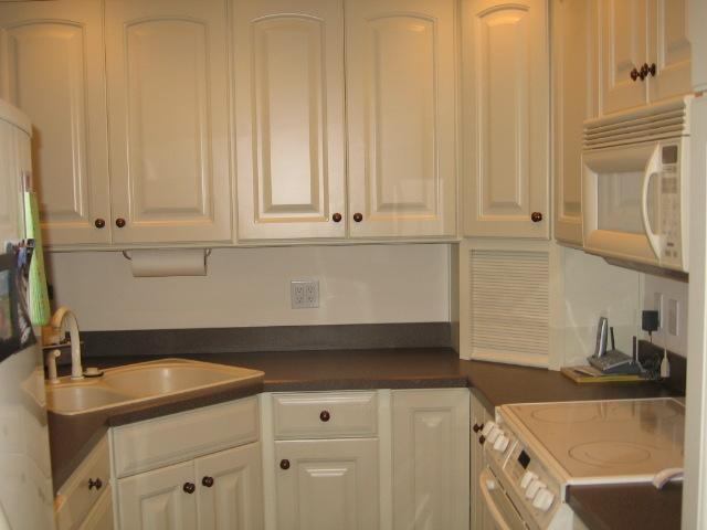 835 Gangplank Road, Unit 117 Moneta, VA 24121 - Photo 5 of 11 a kitchen with granite countertop a sink and a white cabinets