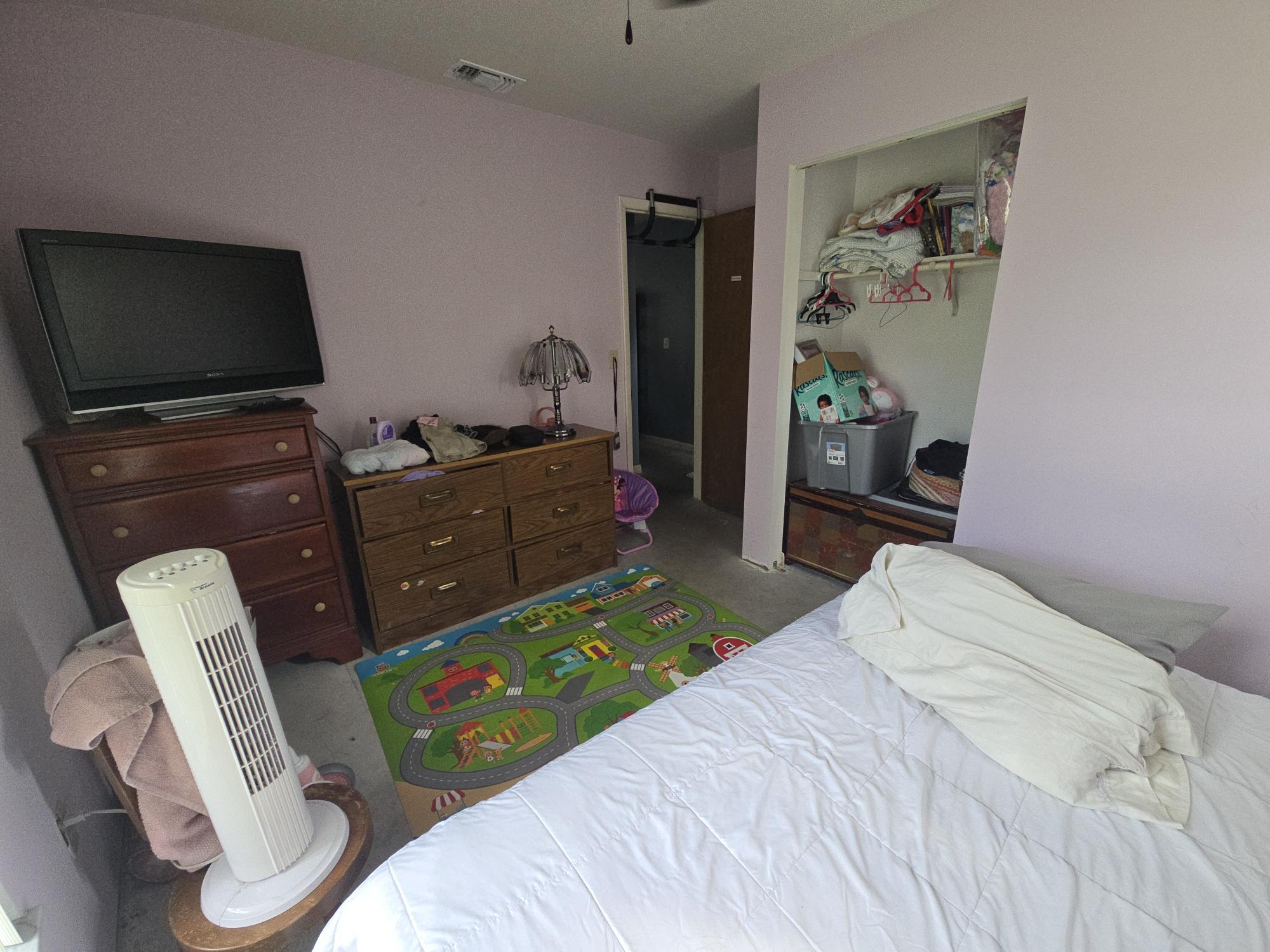 1346 23rd Avenue Southwest Vero Beach, FL 32962 - Photo 19 of 31 a bedroom with a bed and furniture