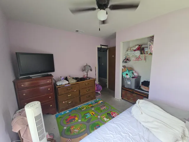 a bedroom with a bed and furniture