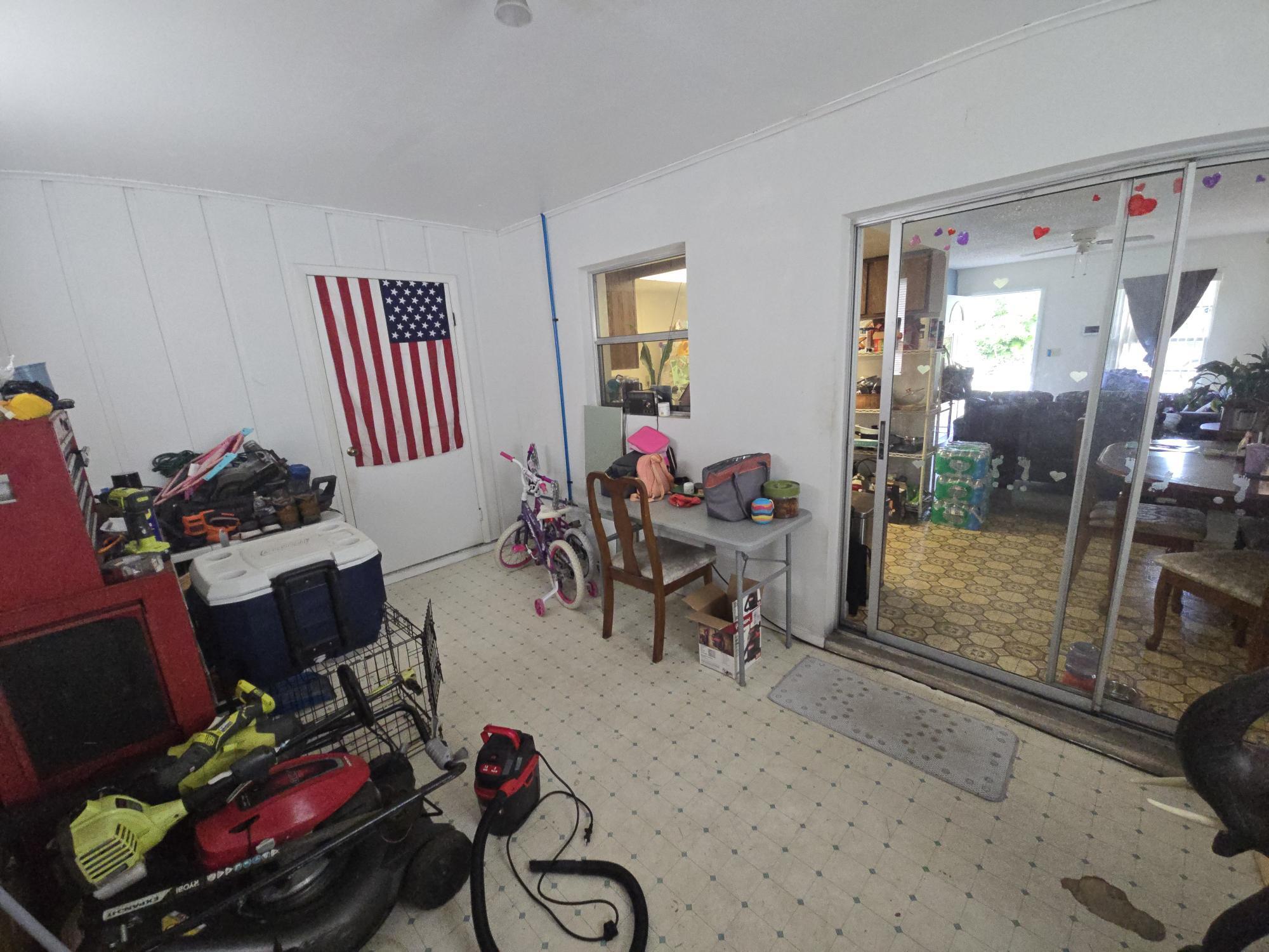 1346 23rd Avenue Southwest Vero Beach, FL 32962 - Photo 23 of 31 a living room with furniture and a flat screen tv