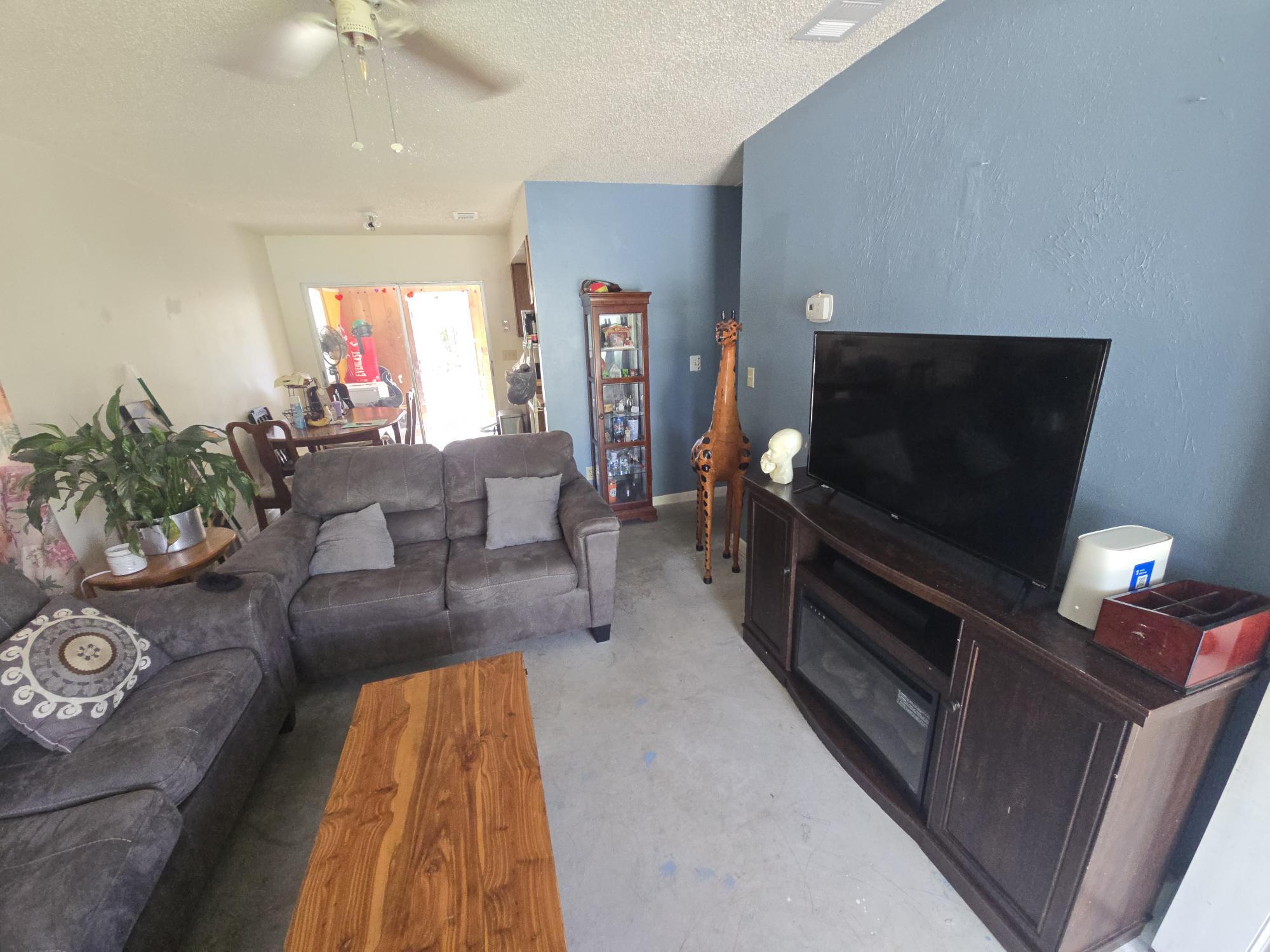 1346 23rd Avenue Southwest Vero Beach, FL 32962 - Photo 5 of 31 a living room with furniture and a flat screen tv