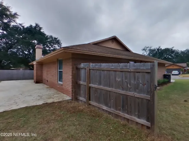 a view of backyard with green space