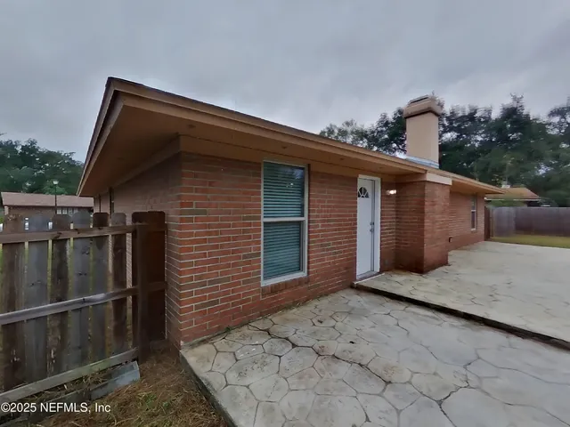 a backyard of a house with lots of green space