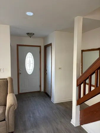a view of a livingroom with wooden floor