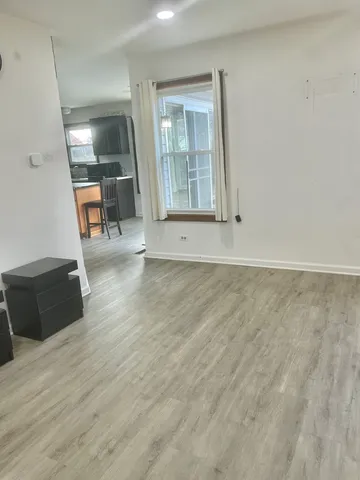 a view of outdoor space with deck and floor to ceiling window