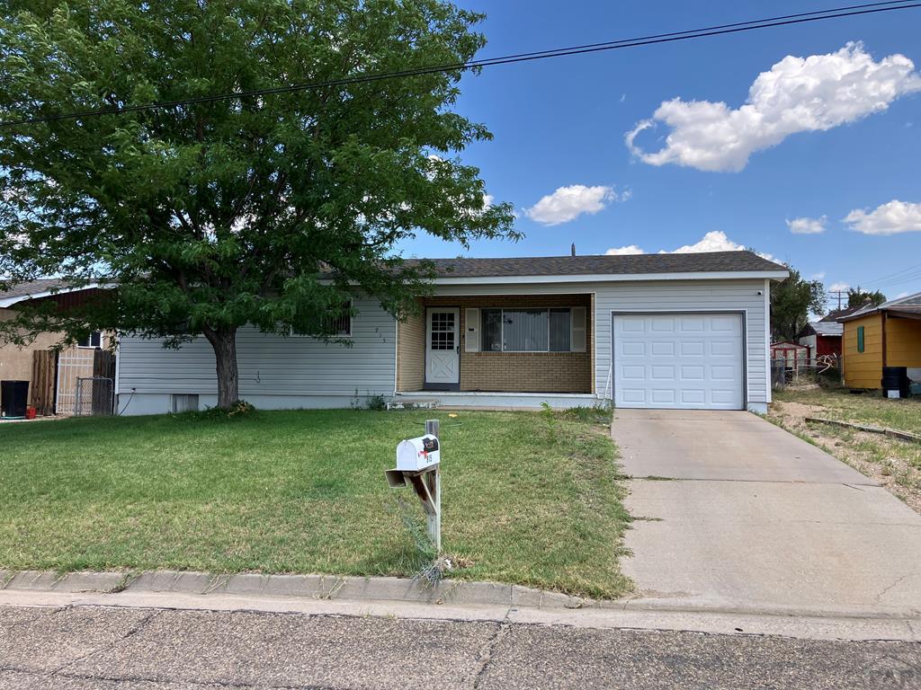 915 Maple Avenue La Junta, CO 81050 - Photo 1 of 34 a front view of a house with garden