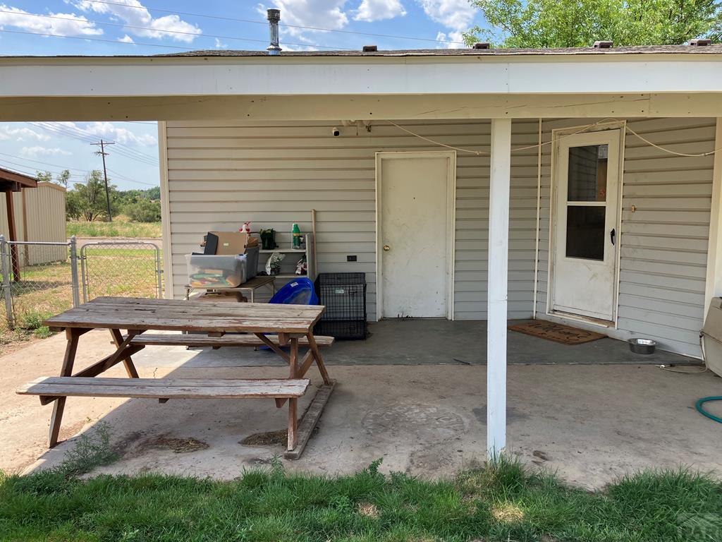 915 Maple Avenue La Junta, CO 81050 - Photo 21 of 34 a backyard of a house with barbeque oven table and chairs