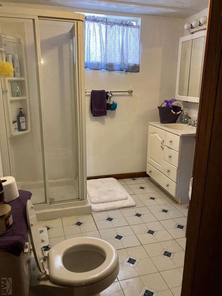 915 Maple Avenue La Junta, CO 81050 - Photo 26 of 34 a bathroom with a sink toilet and shower