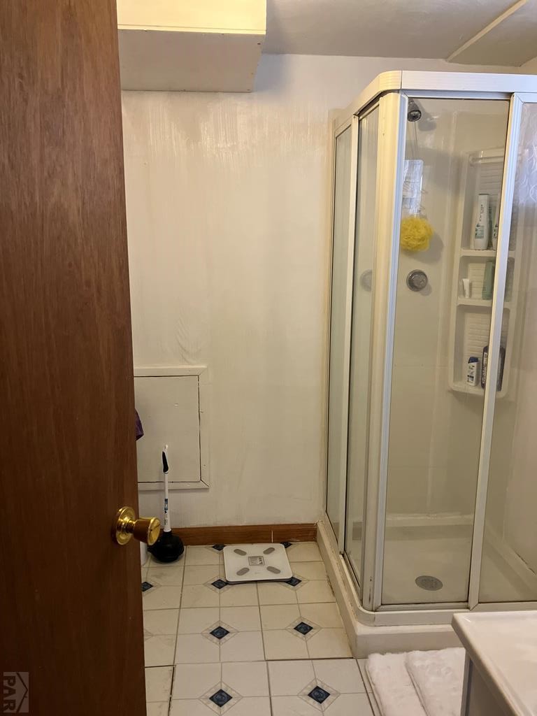 915 Maple Avenue La Junta, CO 81050 - Photo 27 of 34 a bathroom with a shower and a sink