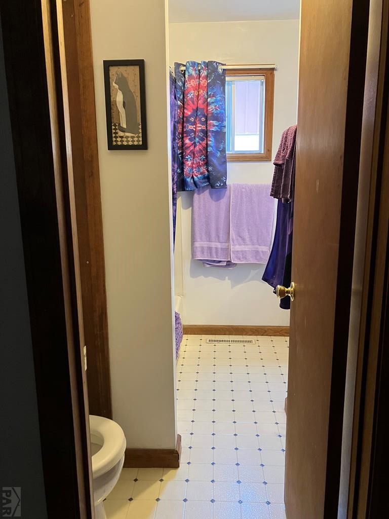915 Maple Avenue La Junta, CO 81050 - Photo 8 of 34 a bathroom with a granite countertop sink and a mirror