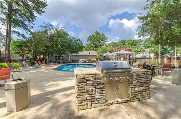 a view of a swimming pool with a lounge chair