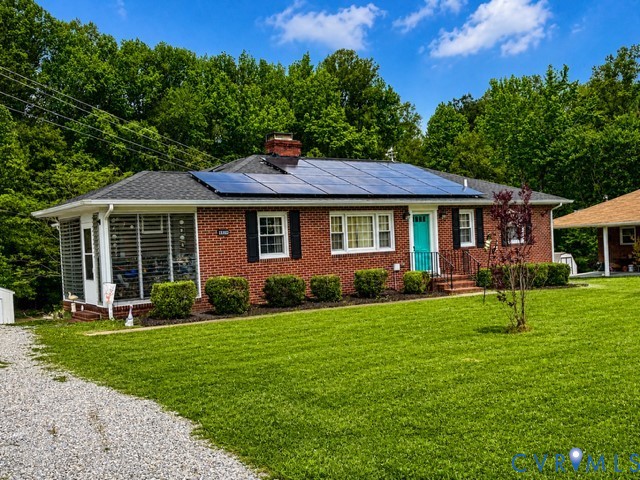 16487 Mountain Road Montpelier, VA 23192 - Photo 1 of 16 a front view of a house with a garden