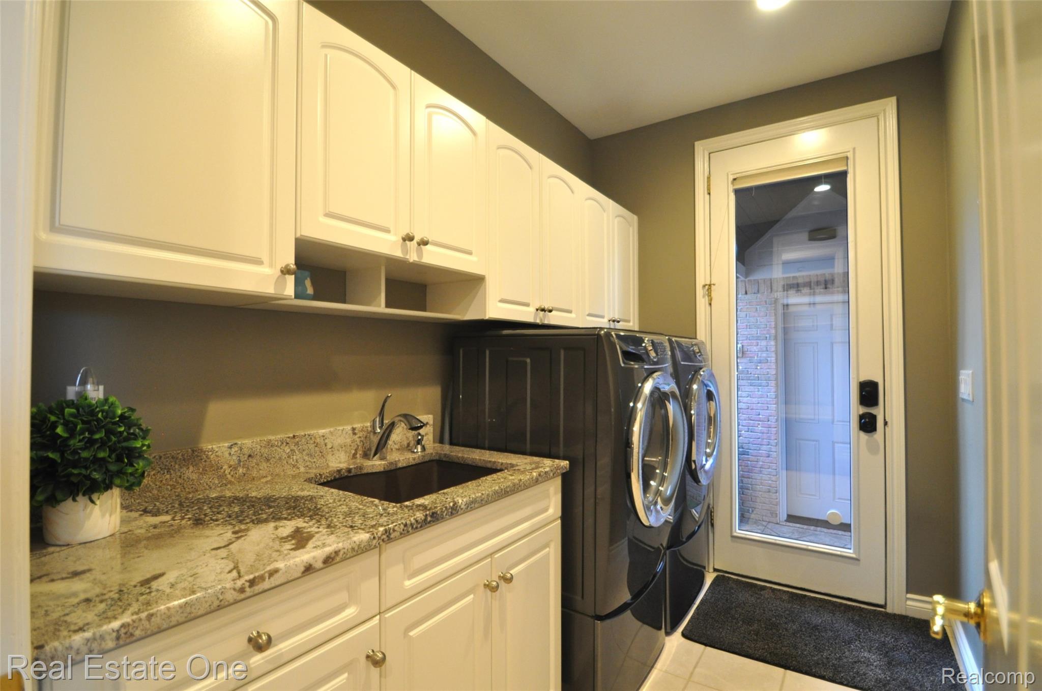 3648 West Tienken Road Rochester, MI 48306 - Photo 26 of 61 Laundry Room with Large Granite Sink and Pull out Faucet.
