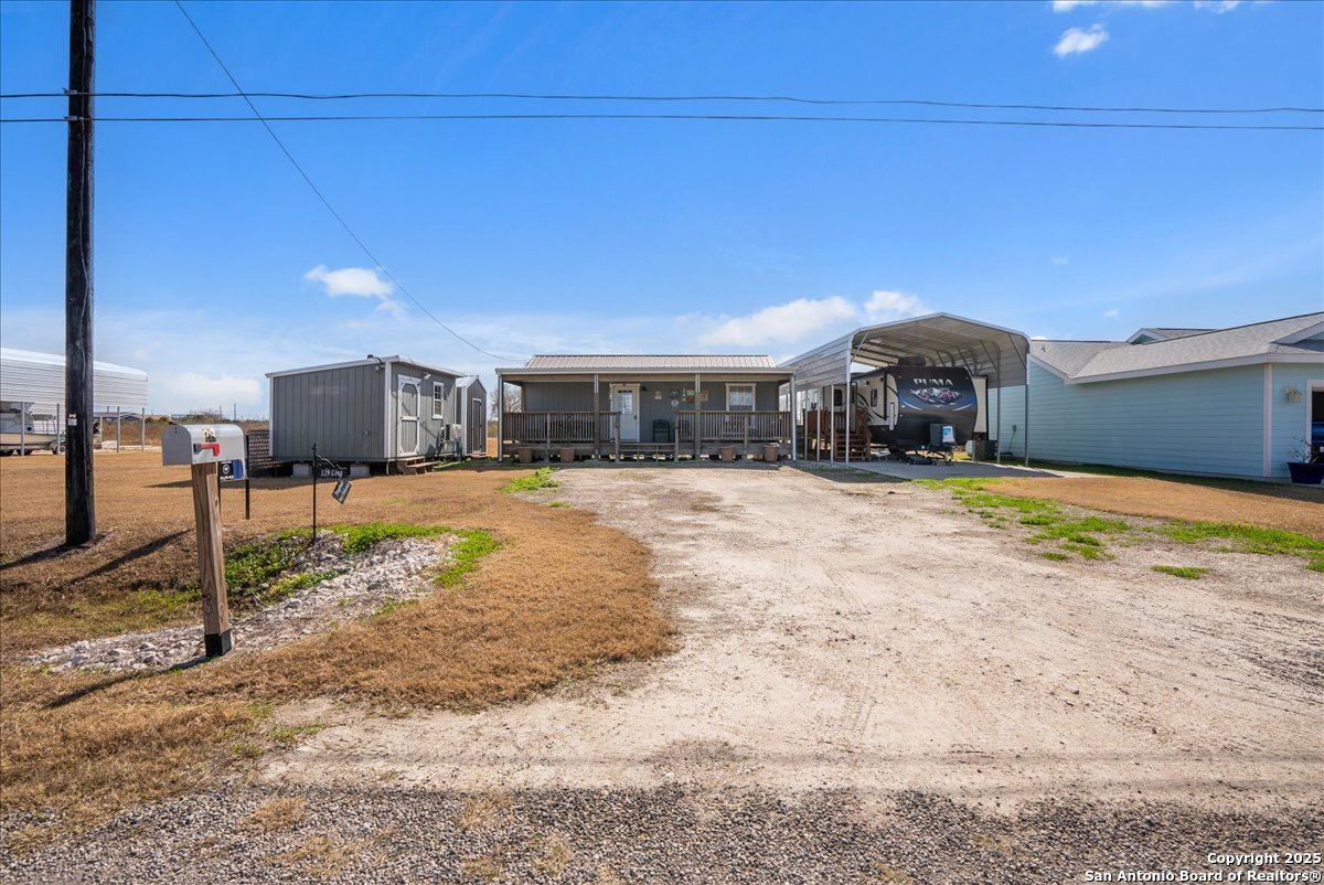 129-131 Ling Road Rockport, TX 78382 - Photo 2 of 38 a view of a house with a patio