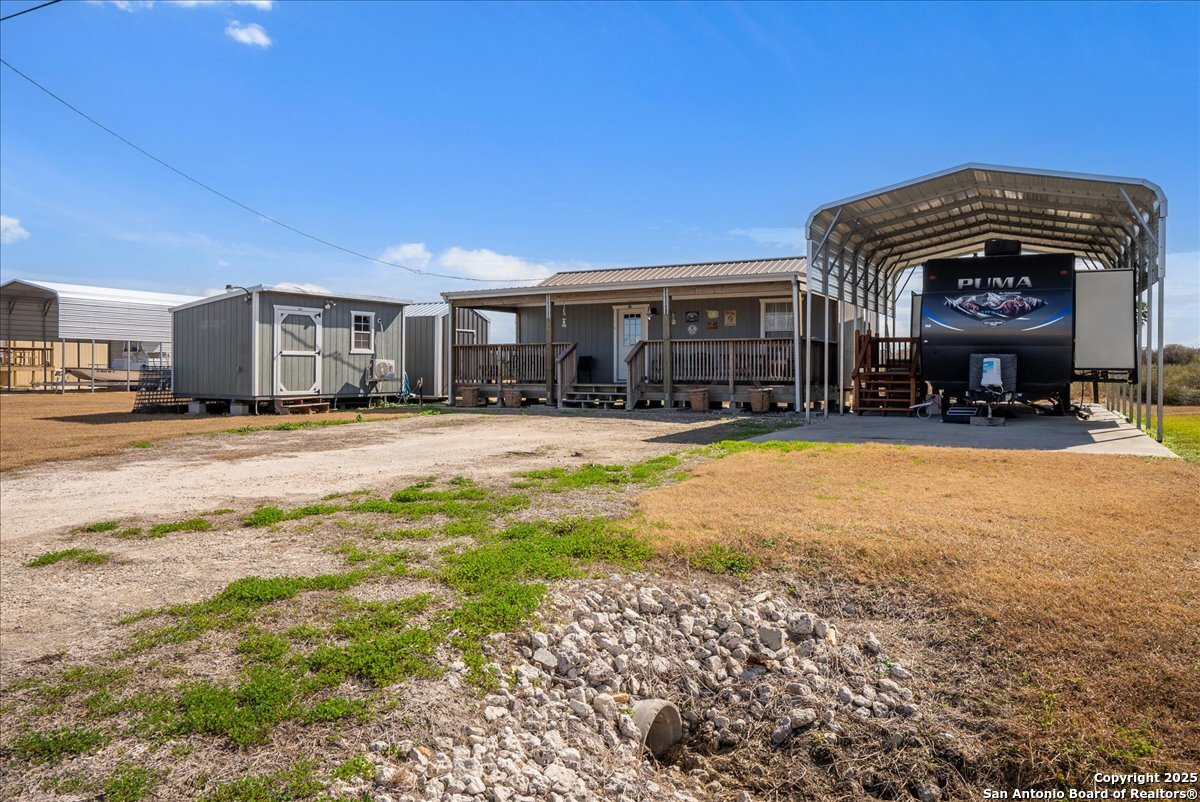 129-131 Ling Road Rockport, TX 78382 - Photo 3 of 38 a view of a house with a yard and sitting area