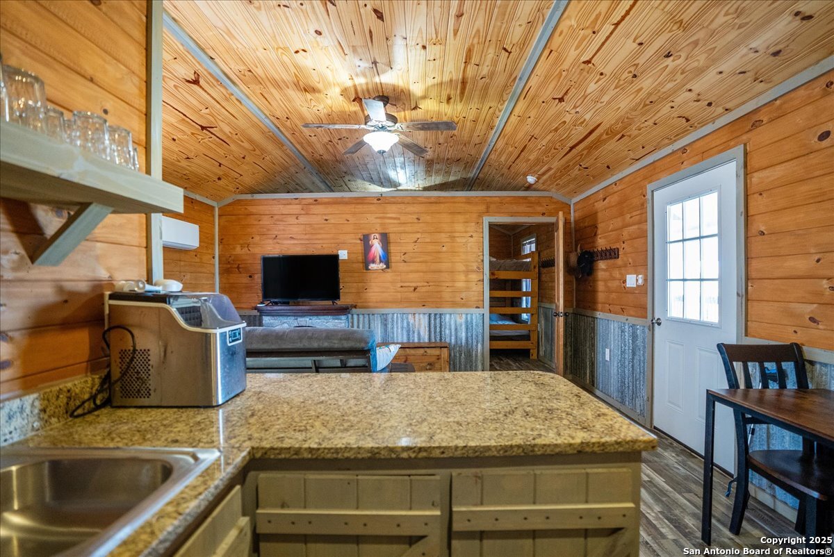 129-131 Ling Road Rockport, TX 78382 - Photo 10 of 38 a kitchen with kitchen island a sink and stove