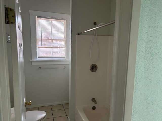 4725 Avenue R 1/2 Galveston, TX 77551 - Photo 7 of 18 a bathroom with a shower and a sink