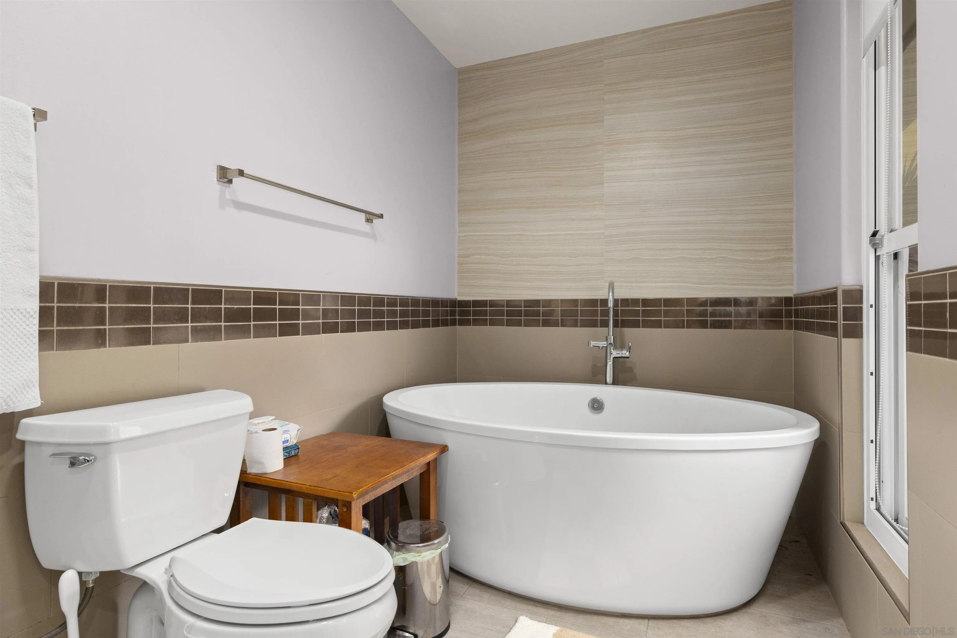 752 Bracero Road Encinitas, CA 92024 - Photo 24 of 46 a white toilet sitting next to a bathroom sink