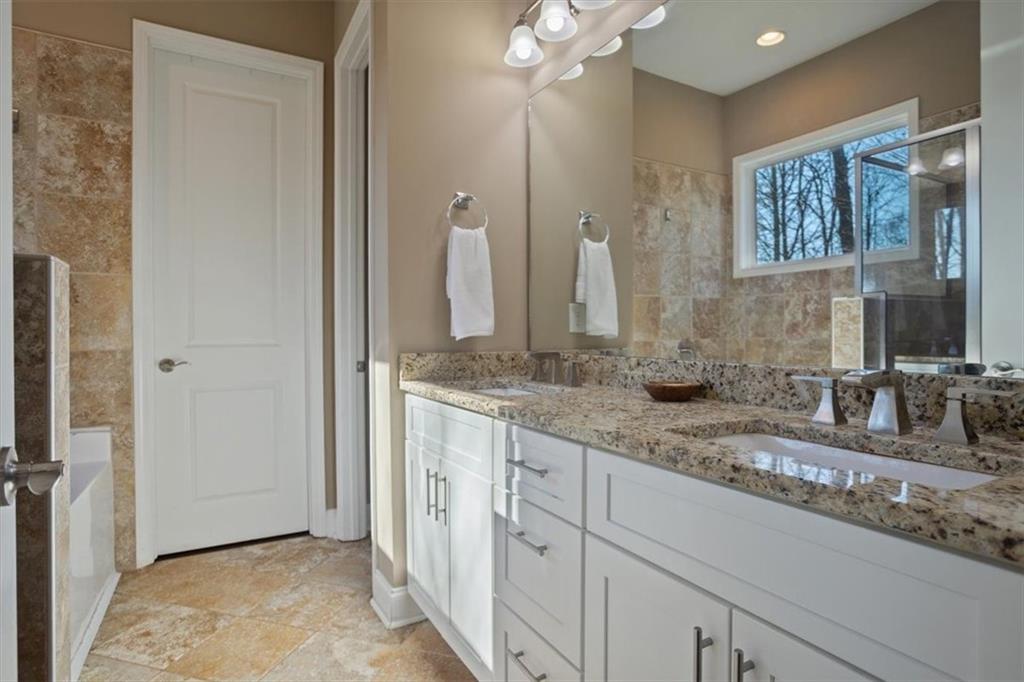 108 Madison Court Jasper, GA 30143 - Photo 12 of 36 a bathroom with a double vanity sink and a mirror