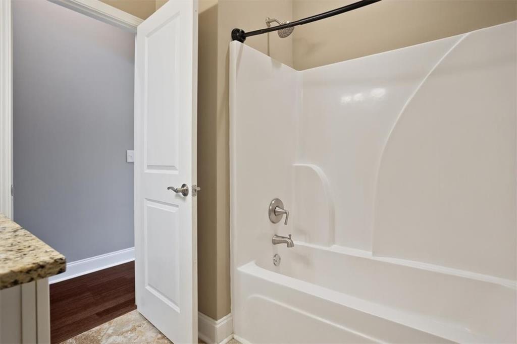 108 Madison Court Jasper, GA 30143 - Photo 20 of 36 a bathroom with a bathtub and a shower