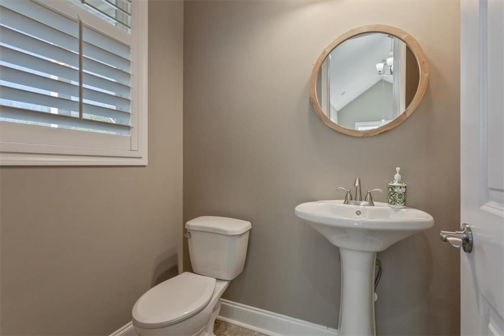108 Madison Court Jasper, GA 30143 - Photo 5 of 36 a bathroom with a sink a mirror and a toilet