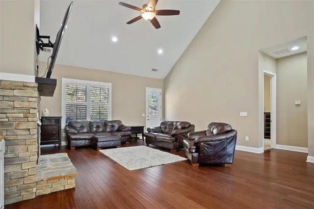 a living room with furniture window and wooden floor