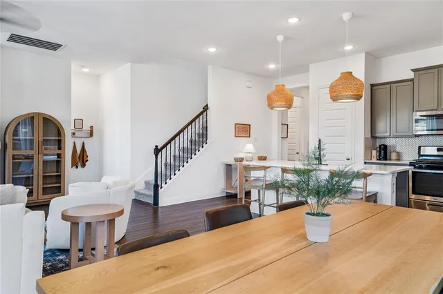 a view of kitchen with furniture and a living room