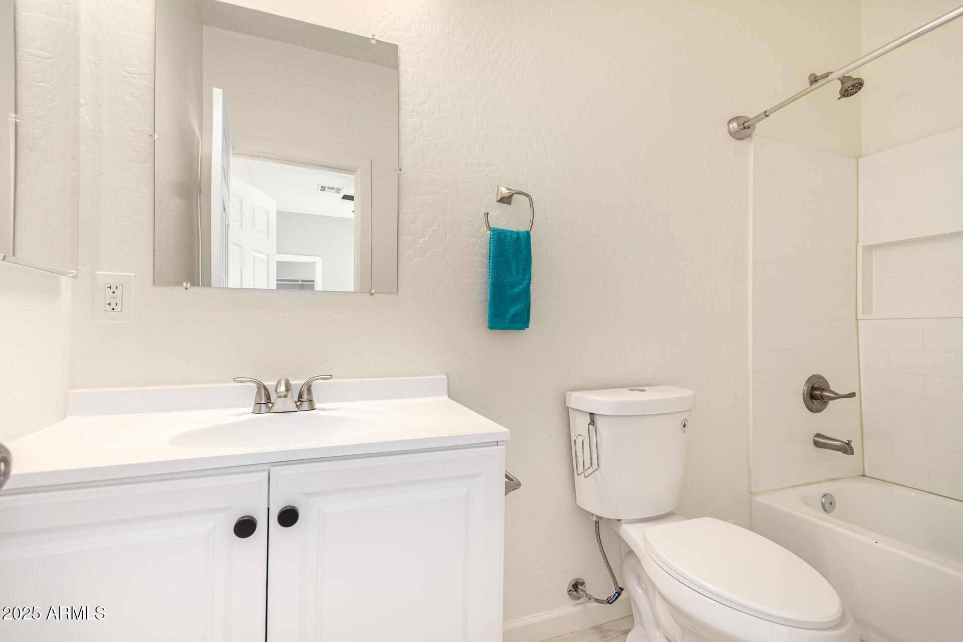 2746 West Pima Street, Unit 2 Phoenix, AZ 85009 - Photo 14 of 25 a bathroom with a sink a toilet and shower