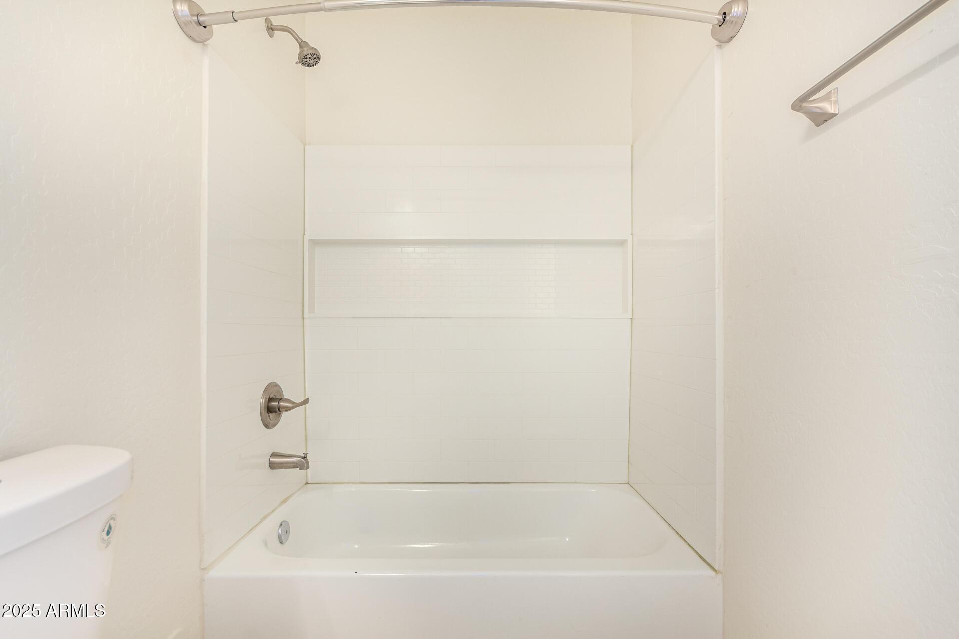 2746 West Pima Street, Unit 2 Phoenix, AZ 85009 - Photo 16 of 24 a bathroom with a bathtub