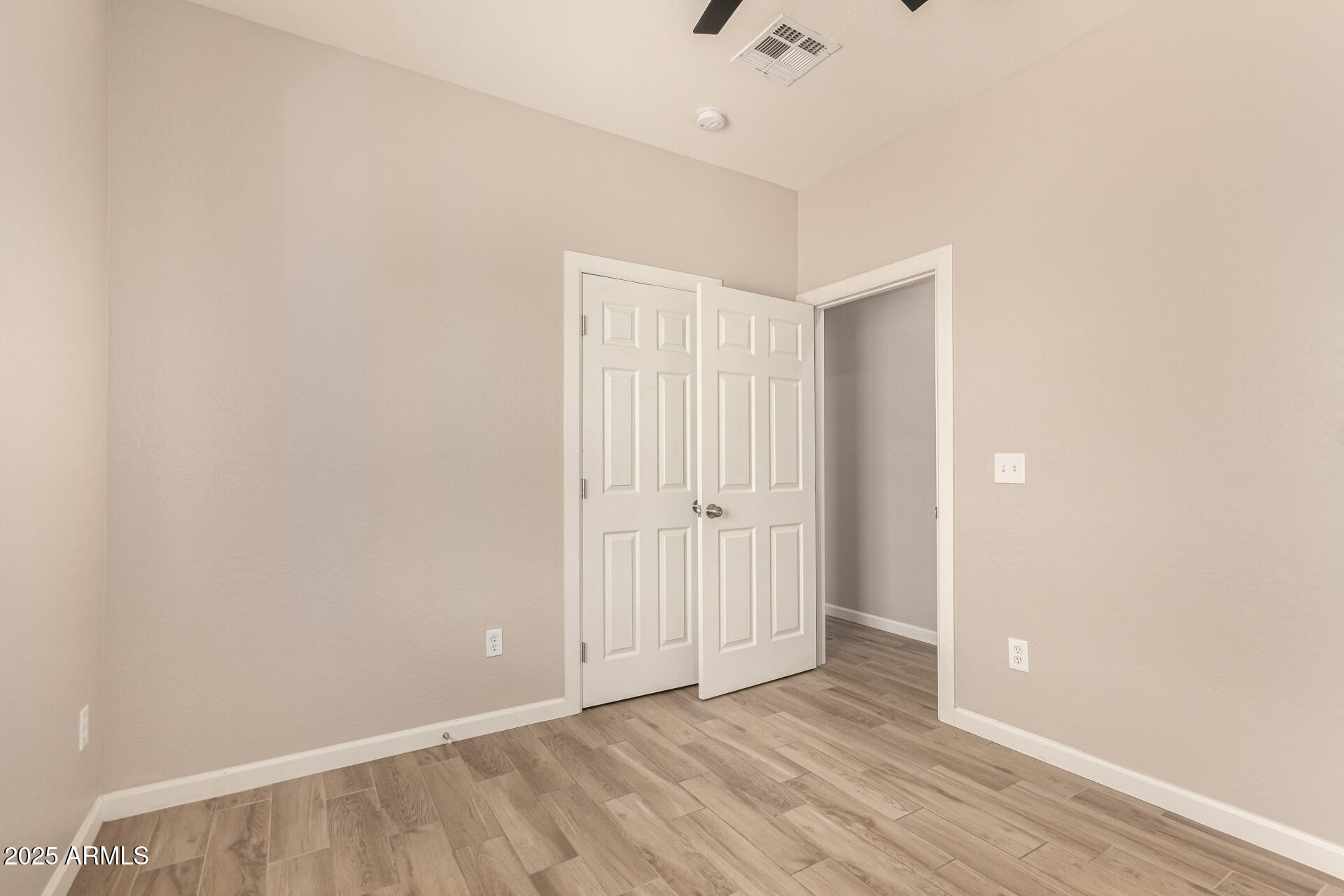 2746 West Pima Street, Unit 2 Phoenix, AZ 85009 - Photo 17 of 25 a view of an empty room with wooden floor