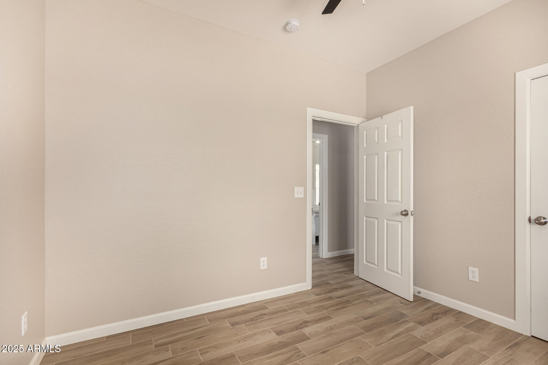 2746 West Pima Street, Unit 2 Phoenix, AZ 85009 - Photo 19 of 25 a view of an empty room with wooden floor