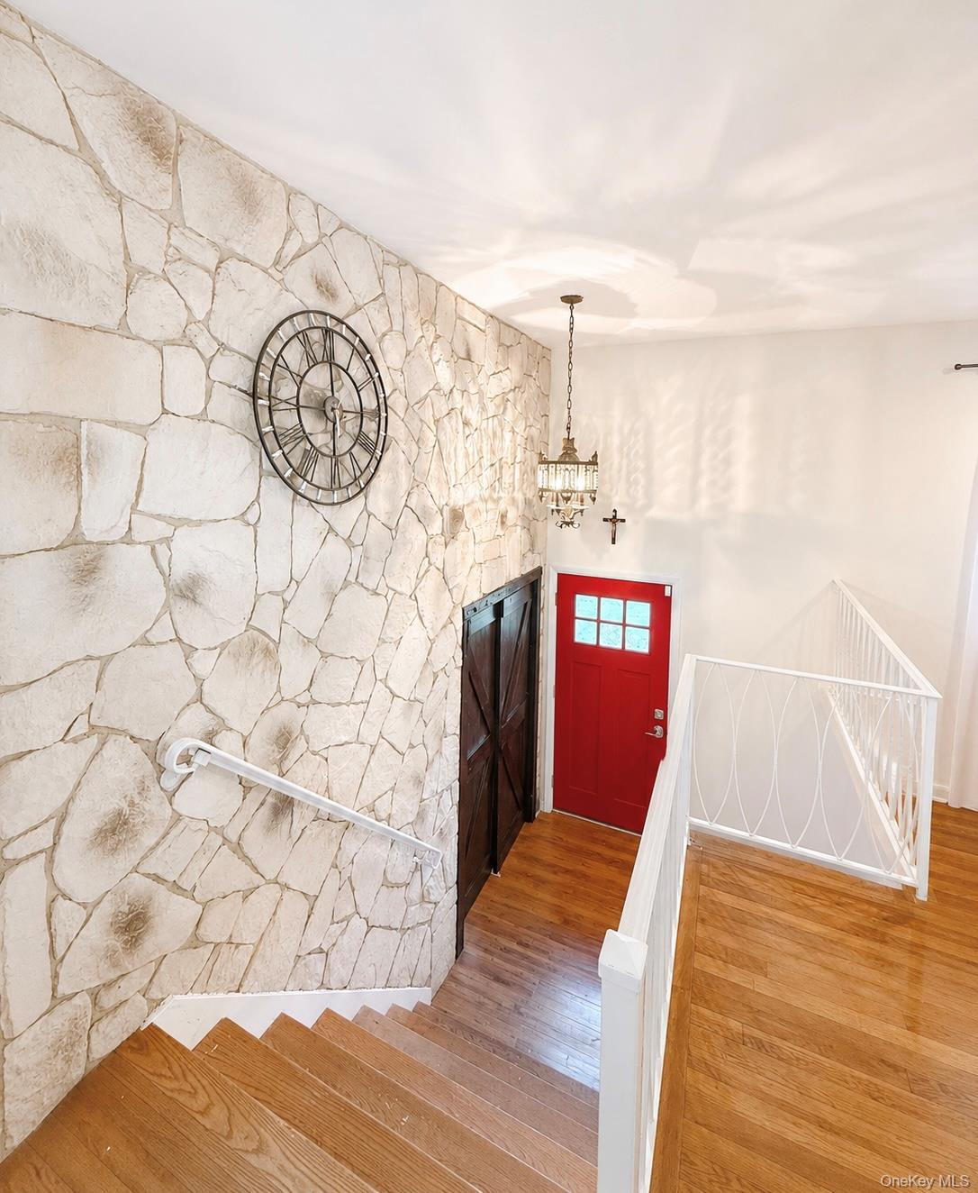 25 Rosman Road Thiells, NY 10984 - Photo 3 of 11 a view of a hallway with wooden floor and door