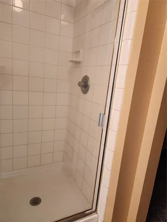 a bathroom with a tub and a shower