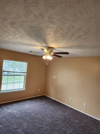 a view of a room that has a window in it