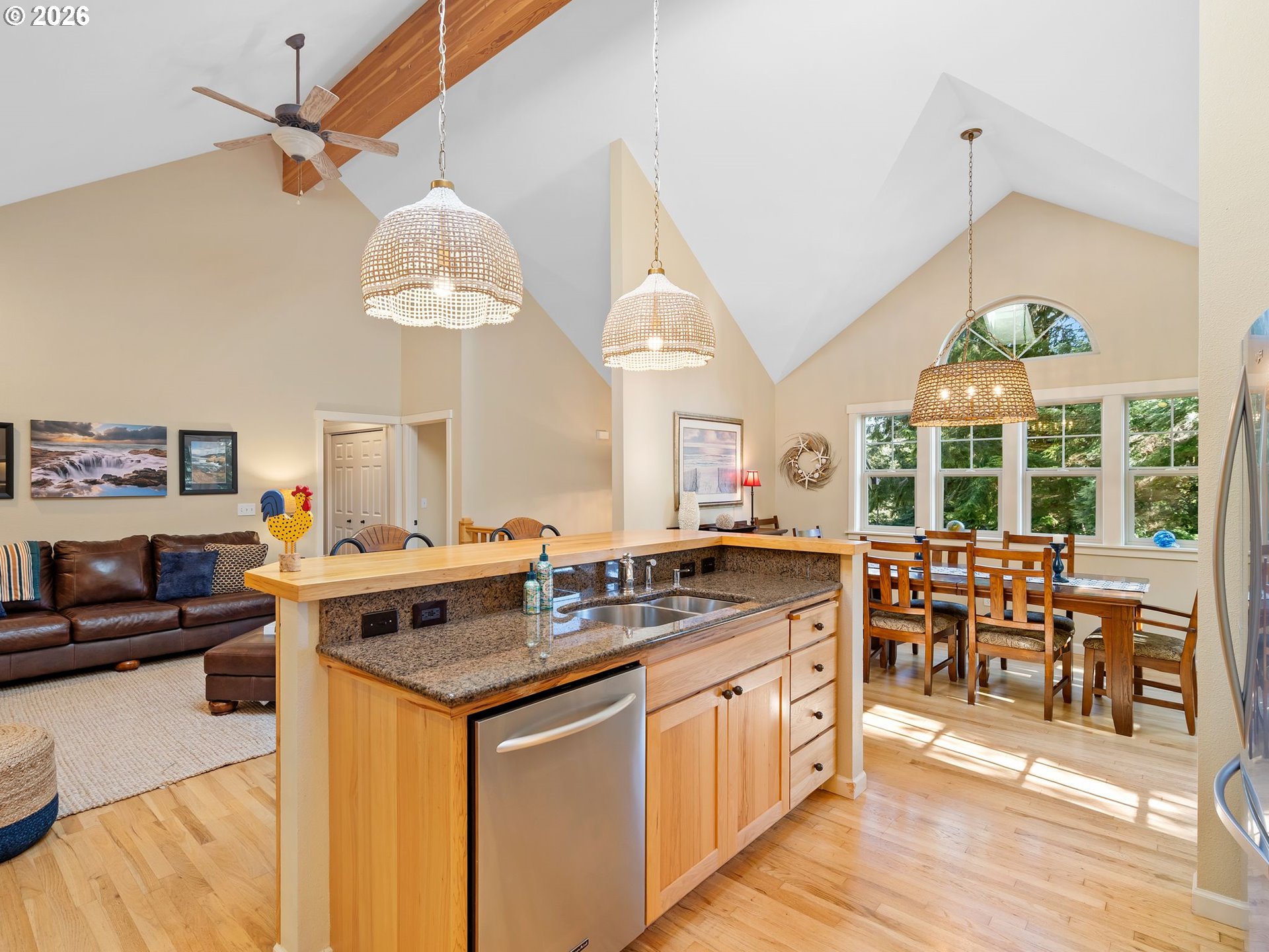 10 Big Tree Road Gleneden Beach, OR 97388 - Photo 12 of 48 a kitchen with stainless steel appliances granite countertop a stove a sink and a refrigerator