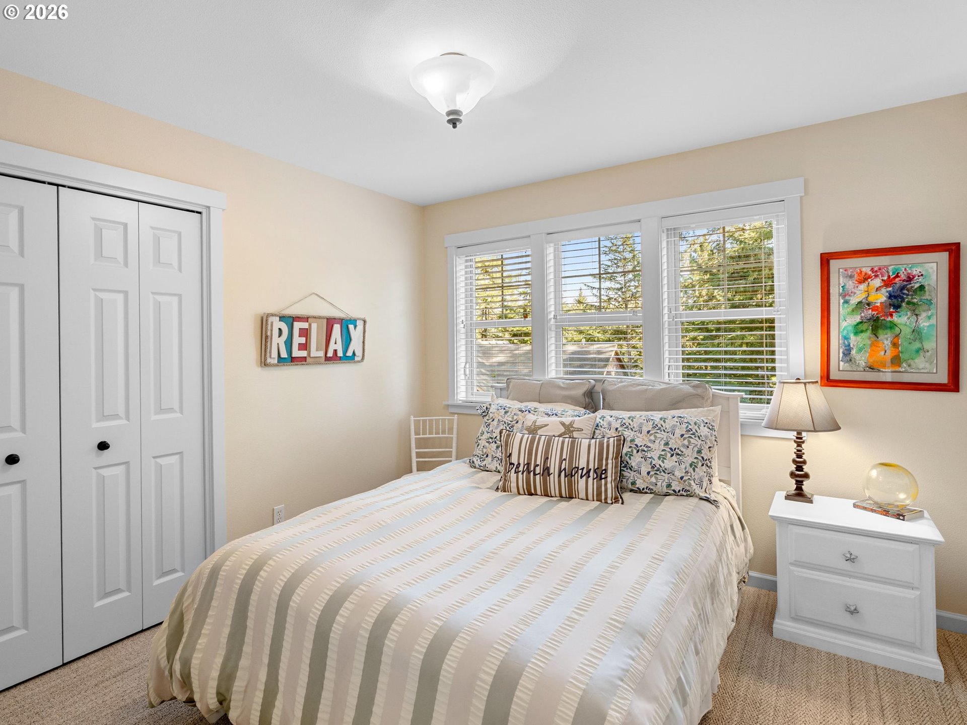 10 Big Tree Road Gleneden Beach, OR 97388 - Photo 15 of 48 a bedroom with a bed and a window