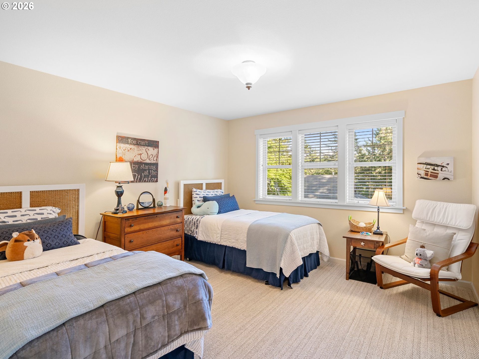 10 Big Tree Road Gleneden Beach, OR 97388 - Photo 17 of 48 a bedroom with two beds and a large window