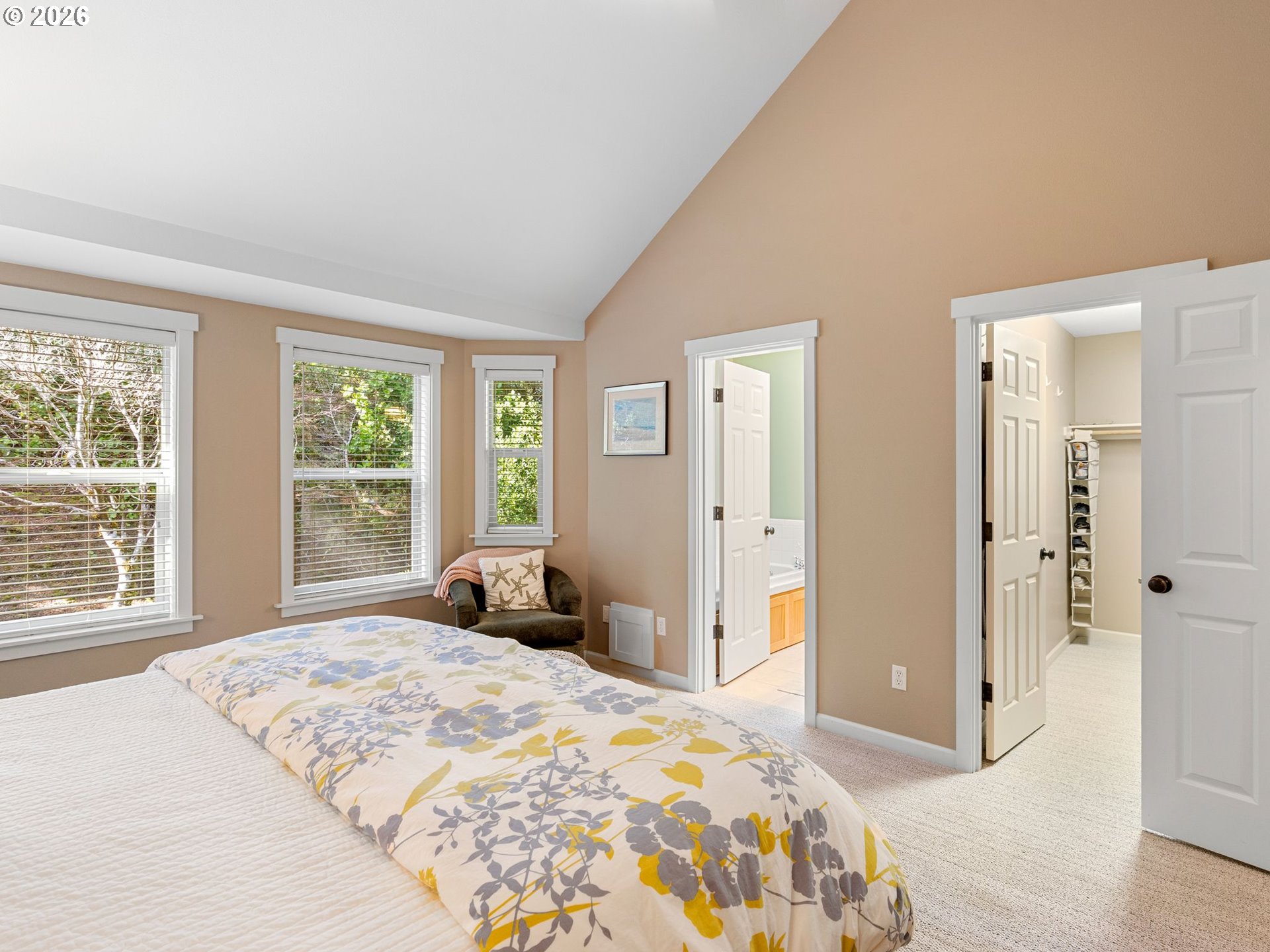 10 Big Tree Road Gleneden Beach, OR 97388 - Photo 20 of 48 a bedroom with a large bed and a large window