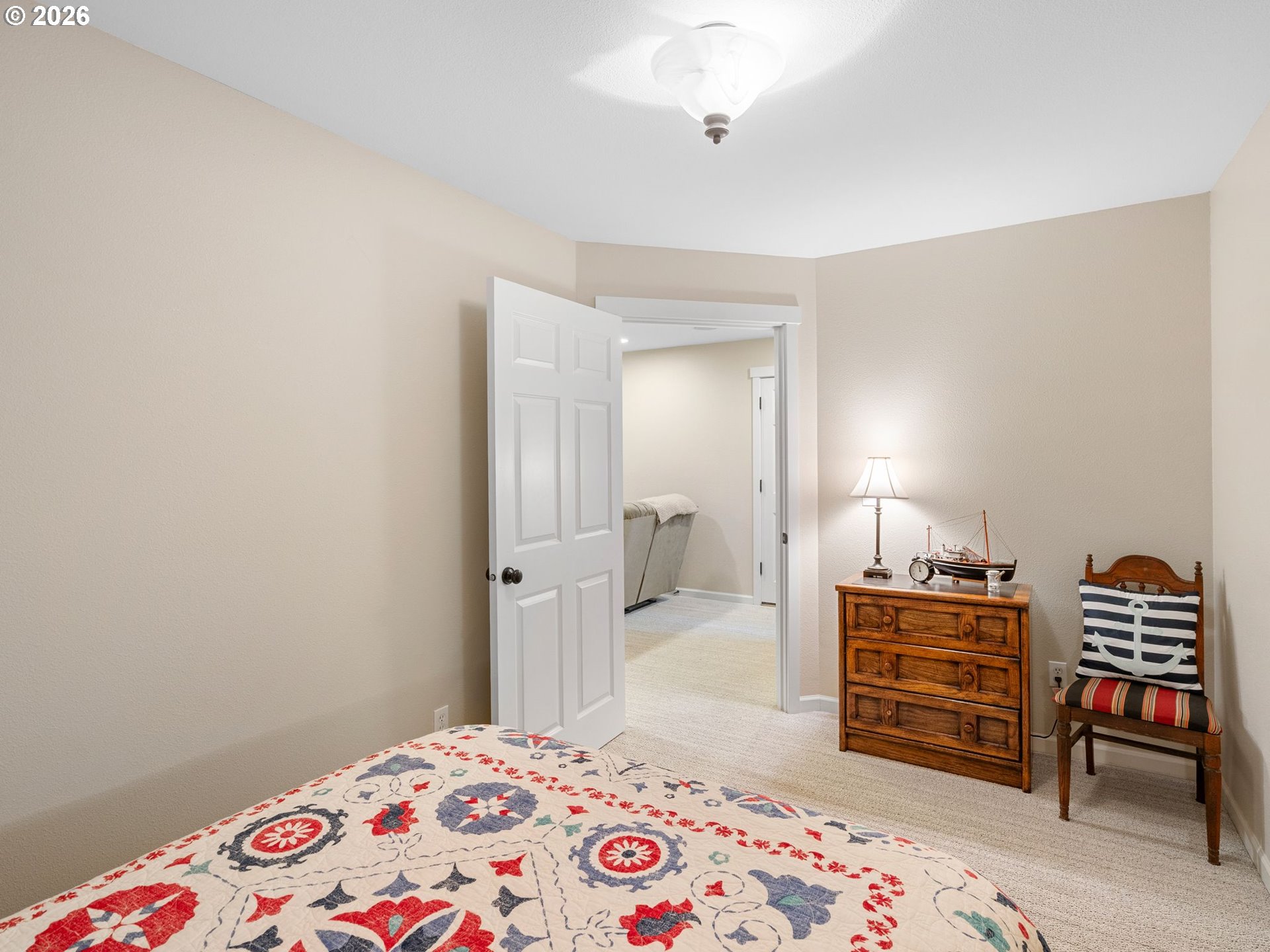 10 Big Tree Road Gleneden Beach, OR 97388 - Photo 29 of 48 a bedroom with a bed and a chair